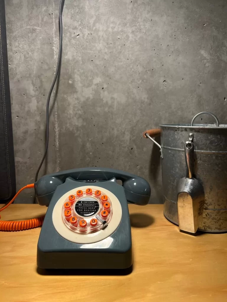 Grey and orange retro stye telephone in the Queen Room of the Moxy Hotel, San Diego