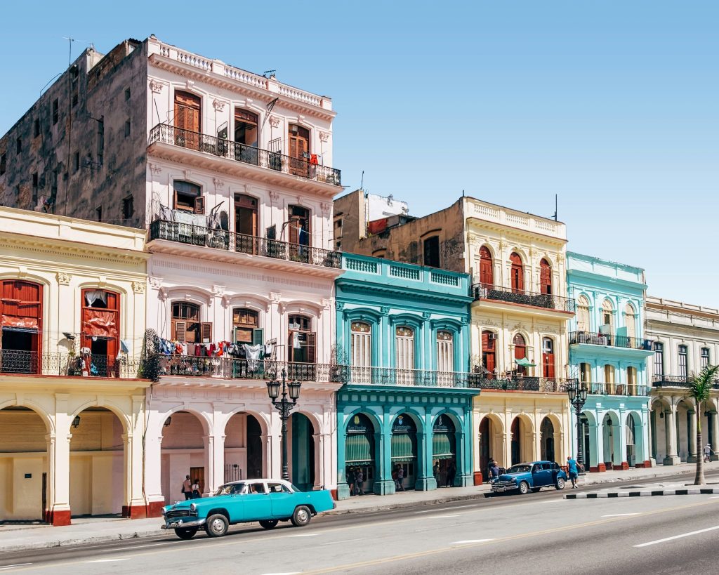 Havana coloured buildings with classic car in front of them