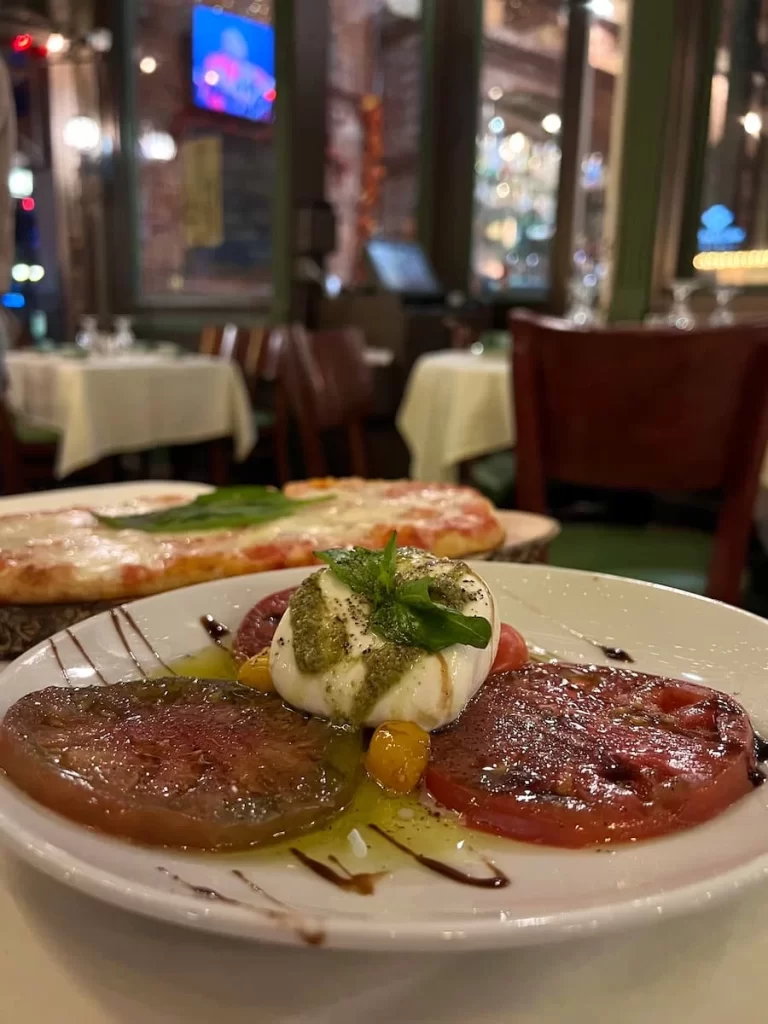 Vegetarian-friendly food in San Diego: Burrata and tomato salad at Osteria Panevino in San Diego.