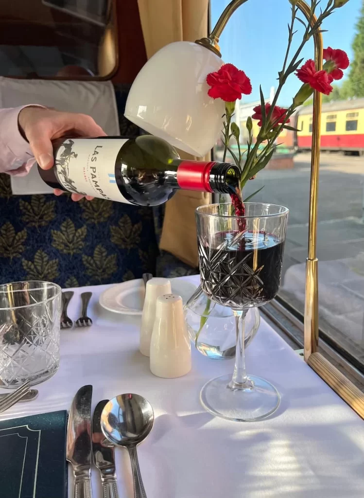 Malbec wine being poured in to Crystal glass at Loughborough Central Station  