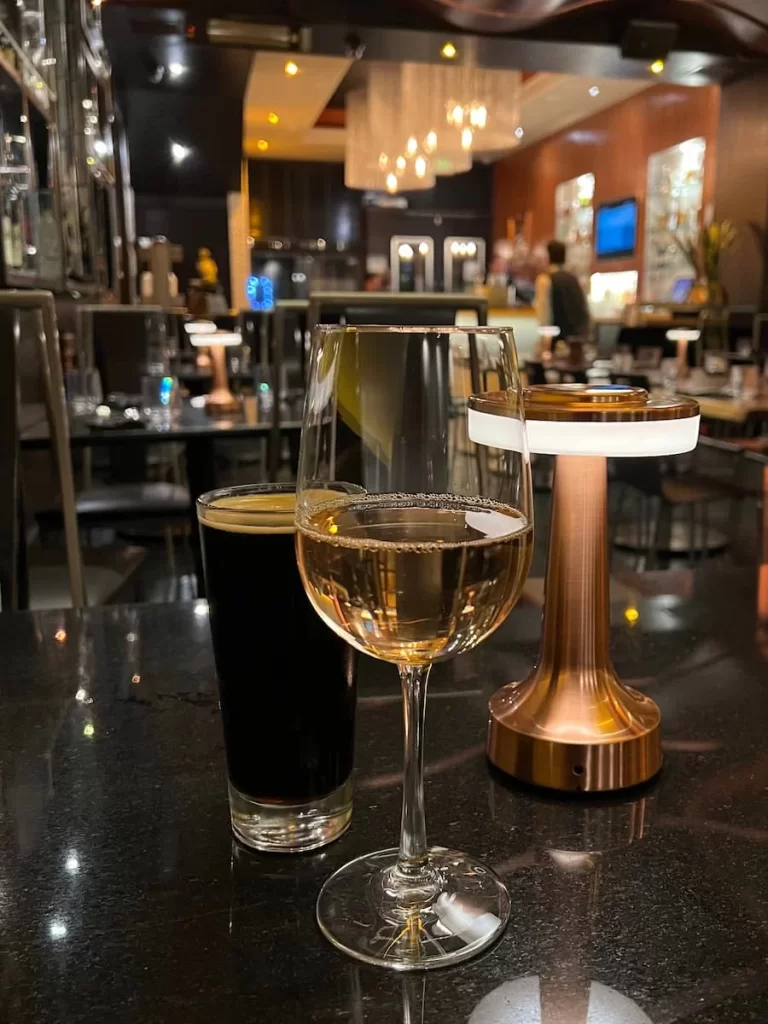 Glass of white wine and local ale at Bandar, San Diego