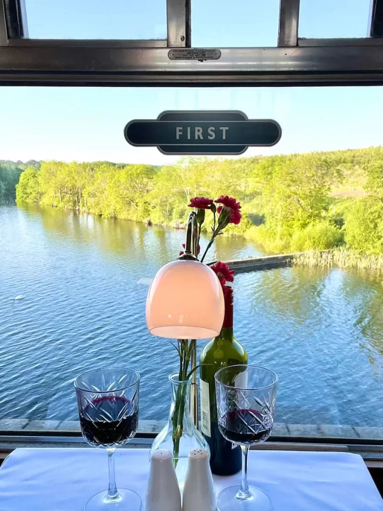 Glasses of red wine overlooking Swithland Reservoir on the Great Central Railway