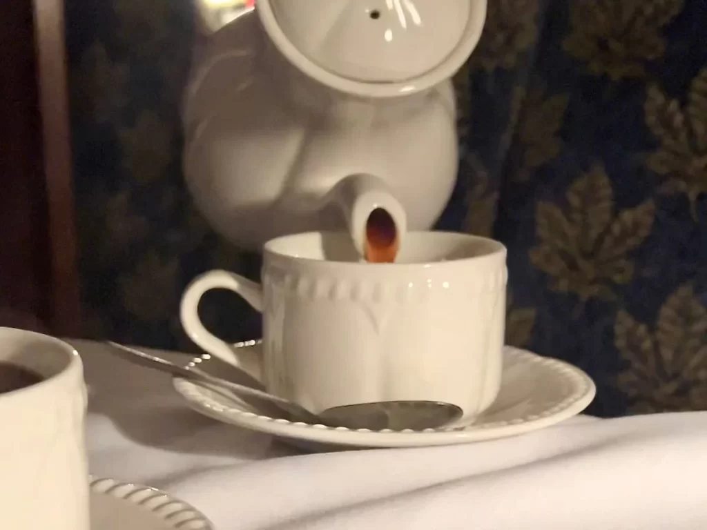 Coffee being poured into a cup aboard The Charnwood Forester