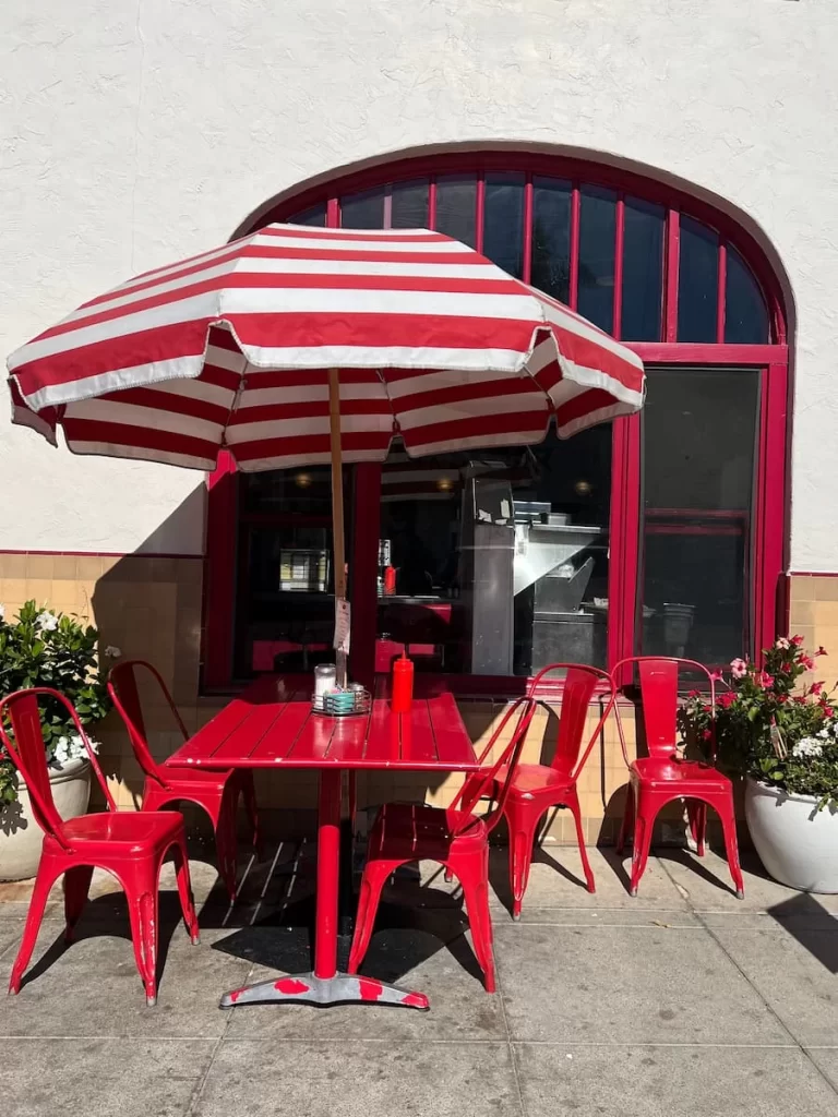 Outside red and white seating at Claytons Coffee Shop, Coronado, San Diego