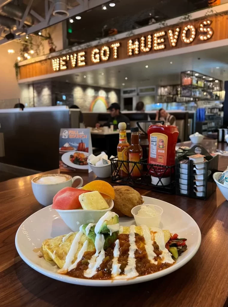 Coffee and breakfast places in San Diego: The Mom omelette with fruit and a blueberry muffin.