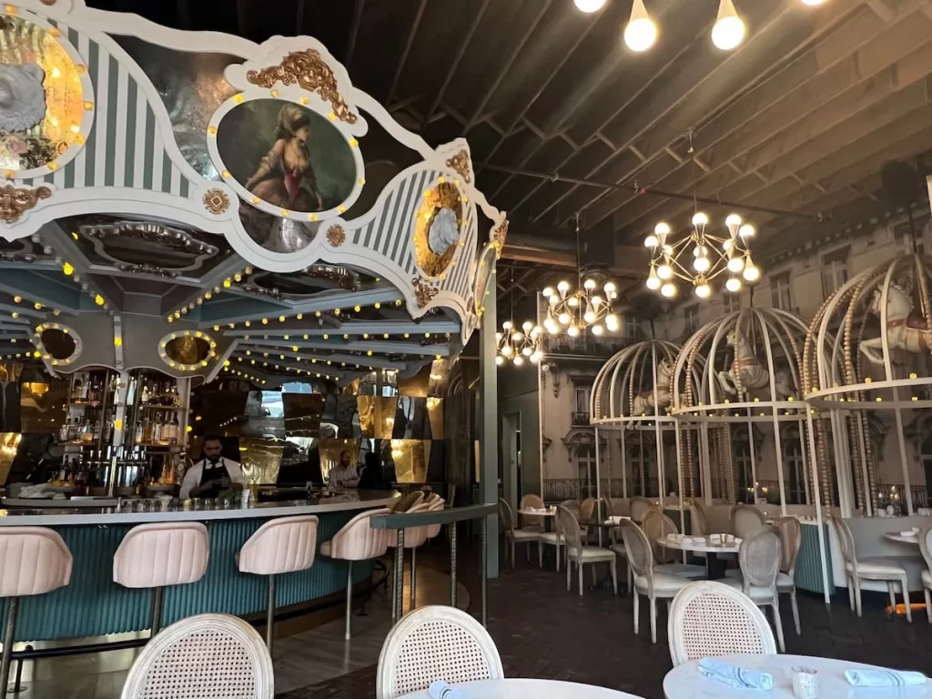 The carousel cocktail bar and stall seating at Wolfie's Carousel Bar, San Diego