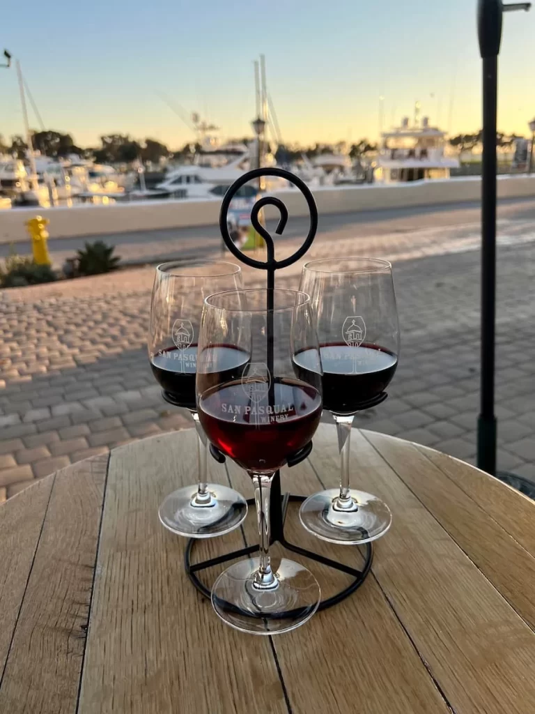 Red wine flights to taste overlooking the harbour at San Pasqual Winery, in Seaport Village San Diego
