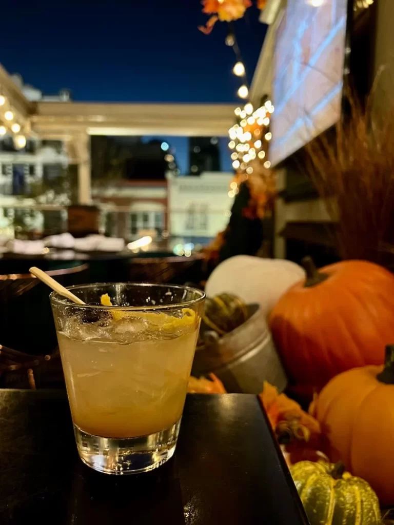 The 1862 sour cocktail nest to pumpkins at Rustic Root, San Diego