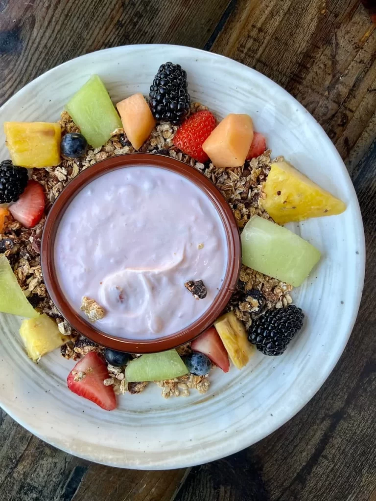 Fruit, yoghurt and granola bowl flat lay at Farmer's Table, Little Italy, San Diego