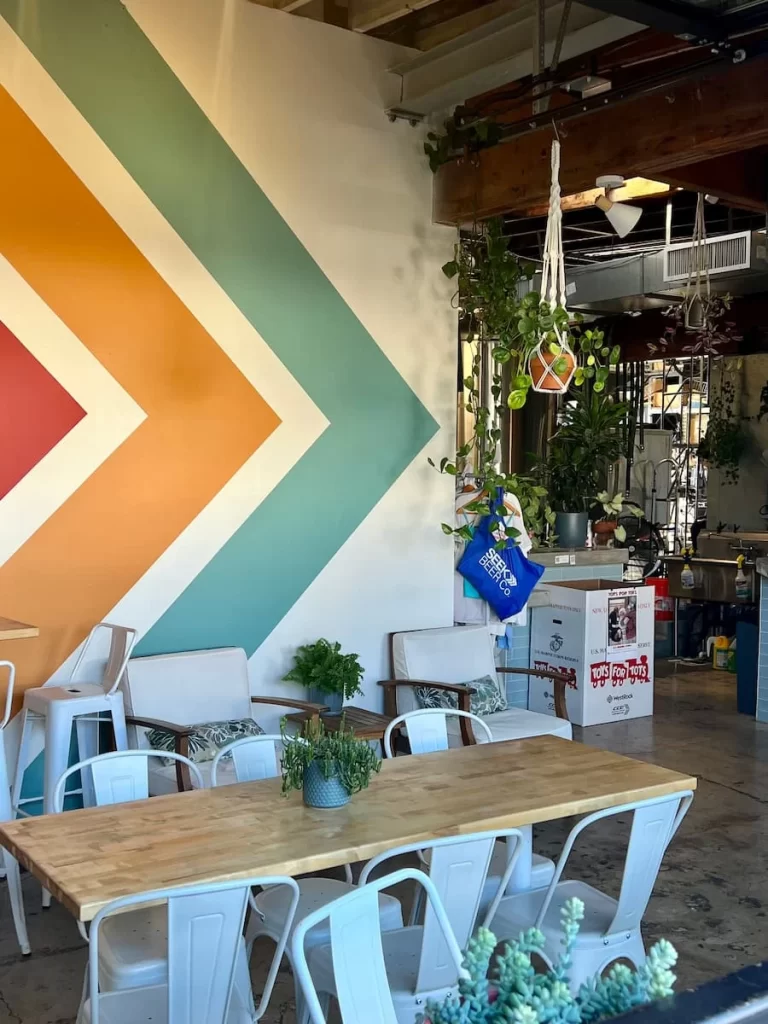 The interiors with plants and a colourful chevron wall at Seek Beer Company, San Diego