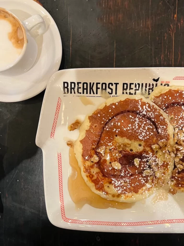 Cinnamon roll pancakes with walnut and a latte at Breakfast Republic, San Diego
