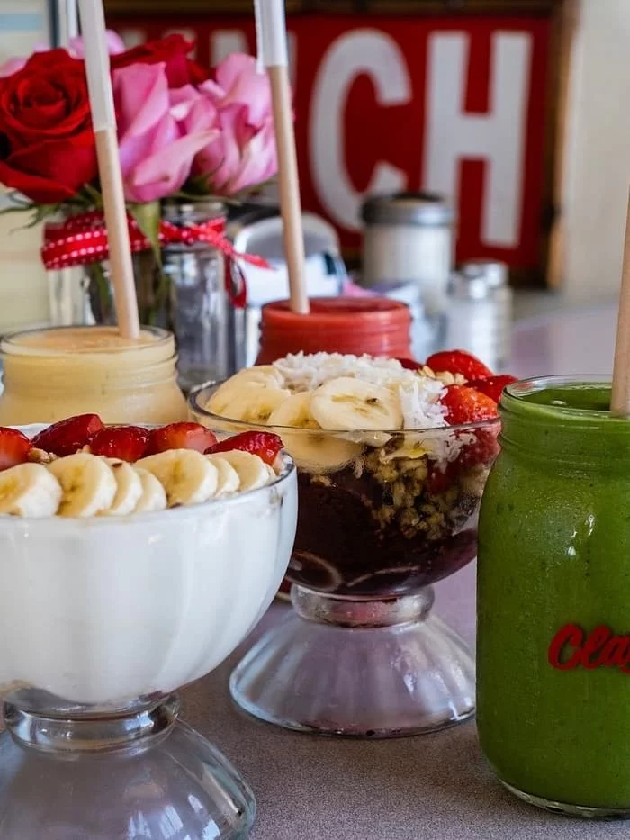 Yoghurt and fruit bowls with coffee at Claytons Coffee Shop, Coronado, San Diego