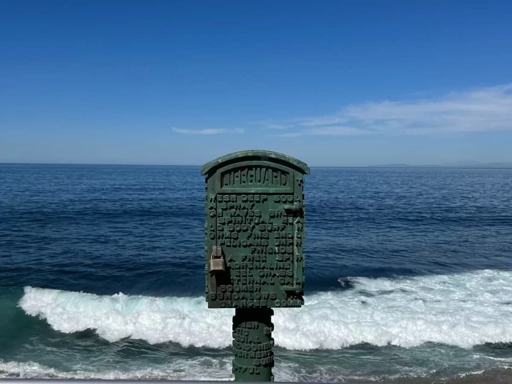 La Jolla letterbox with padlock and the sea in the baclground.