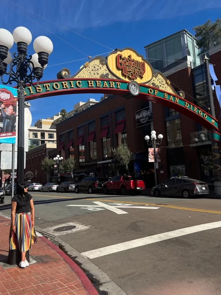 Bejal standing to the side of the Gaslamp Quarter Archway