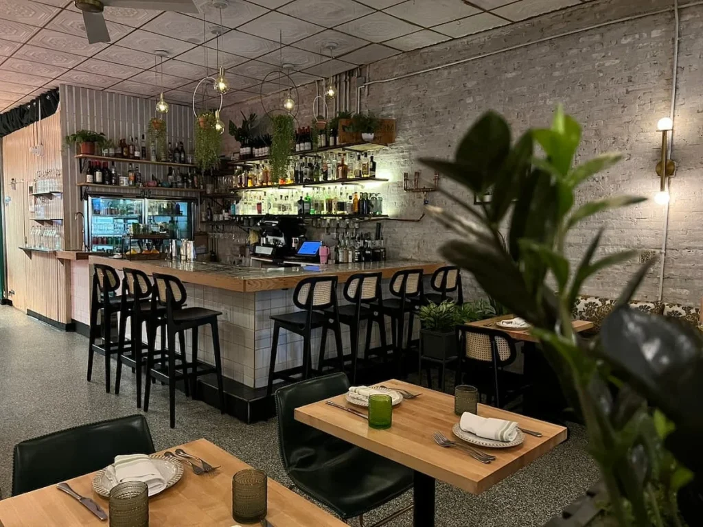 Var area and dining tables at Bloom Plant-Based Kitchen in Chicago