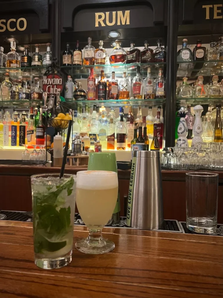 A mojito and a Pisco Sour, on the bar top at Havana Grill, Chicago, vegetarian friendly food in Chicago
