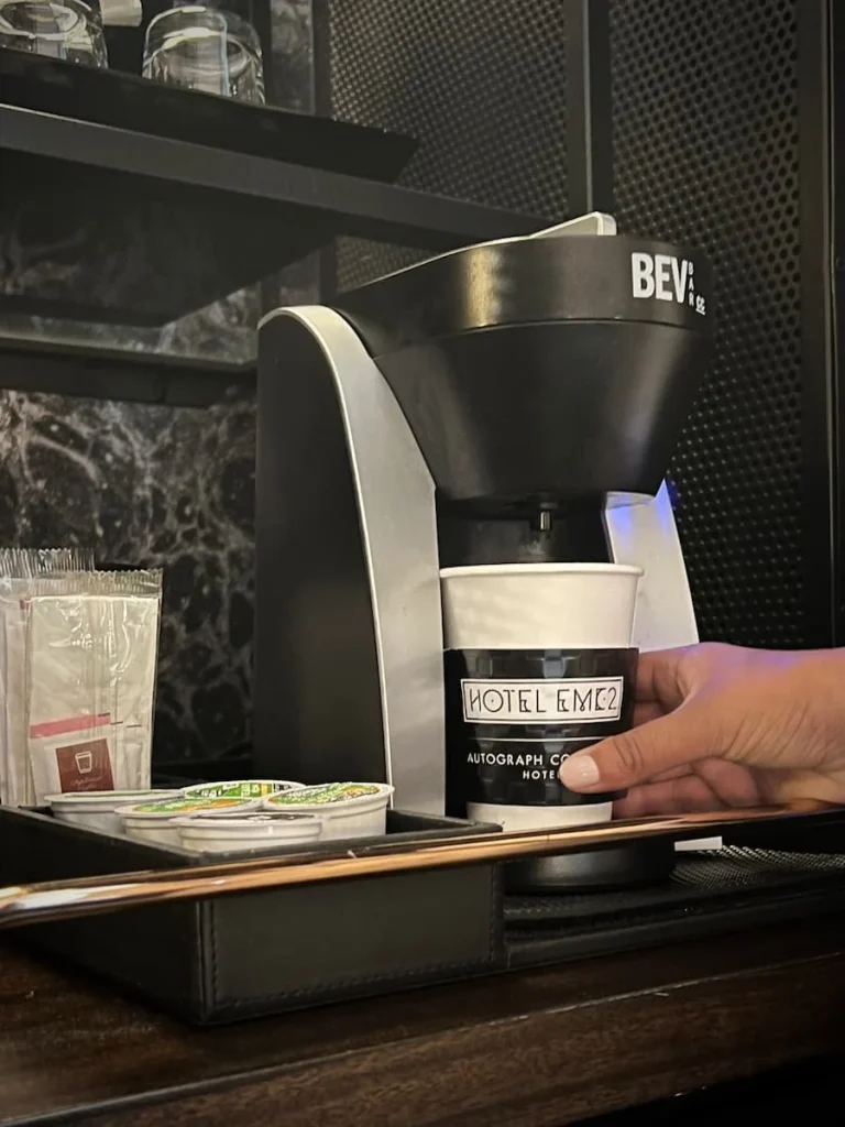 Bejal making a coffee in the Queen Room at Hotel EMC2, one of the cool and quirky boutique hotels in Chicago