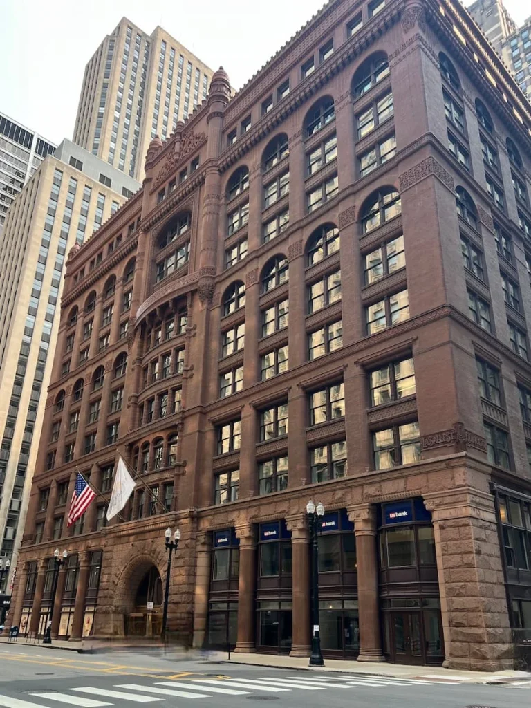 The brown stone exterior of the Rookery Building, Chicago on Lasalle Street. One of the non touristy things to do in Chicago