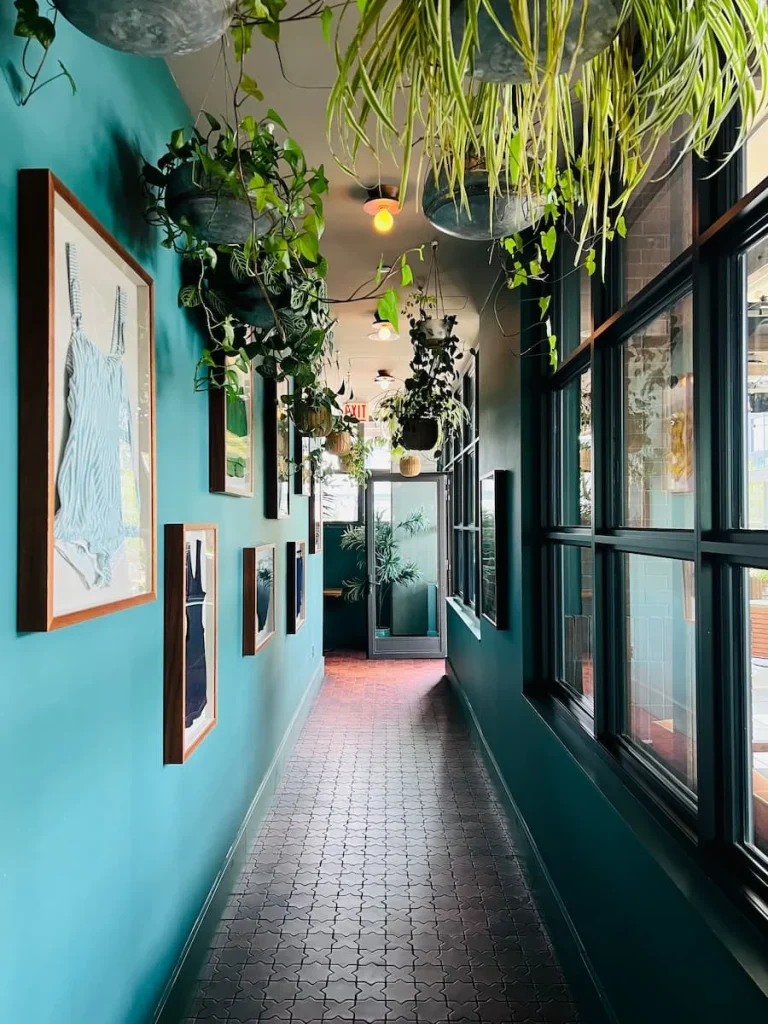 Foliage lined walkway to the pool at La Cabra, The Hoxton, Chicago