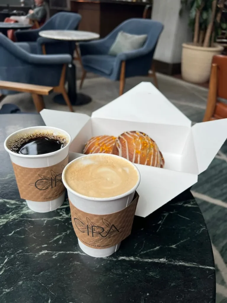 Orange tea cakes with coffee and cappuccino from Cafe Cira, The Hoxton, Chicago. One of the coffee shops in Chicago for vegetarians