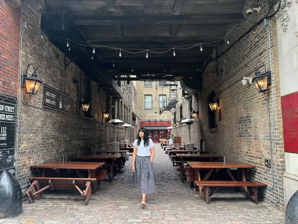 Bejal walking down the courtyard at Green Street Smoked Meats, Chicago