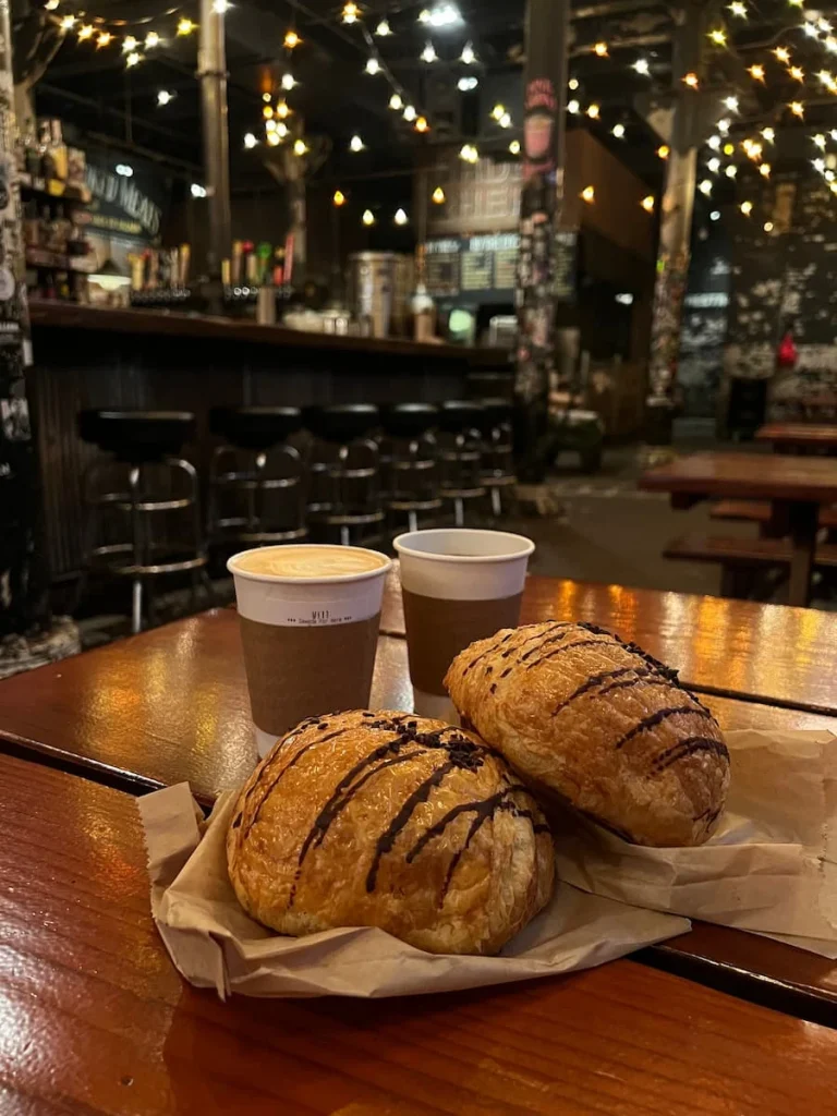 Cappuccino, drip coffee and large chocolate croissants at Sawada Coffee, Chicago
