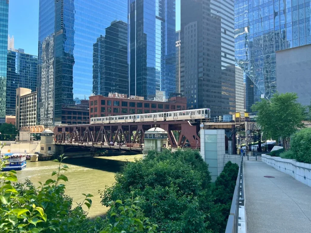 Train on bridge in Chicago with skyscrapers in the background