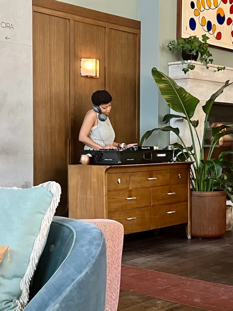 DJ playing the decks in the lobby at The Hoxton, CHicago