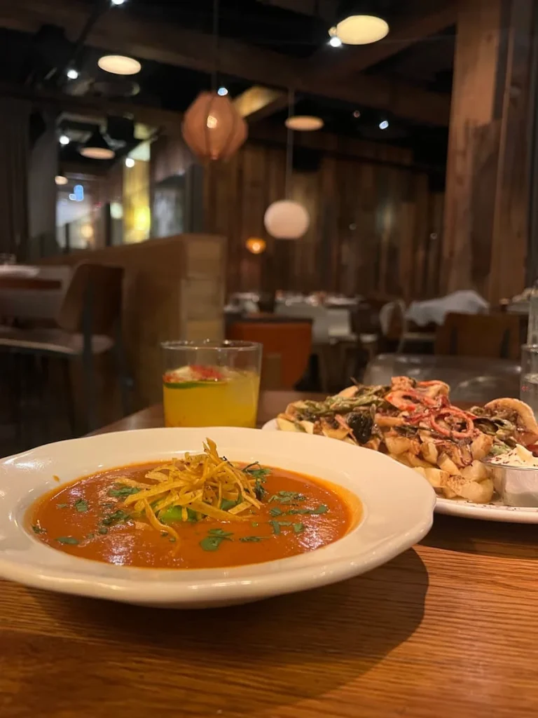 Tortilla soup adn the mango and gin tonic with loaded fries at Beatrix restaurant, Fulton Market, Chicago