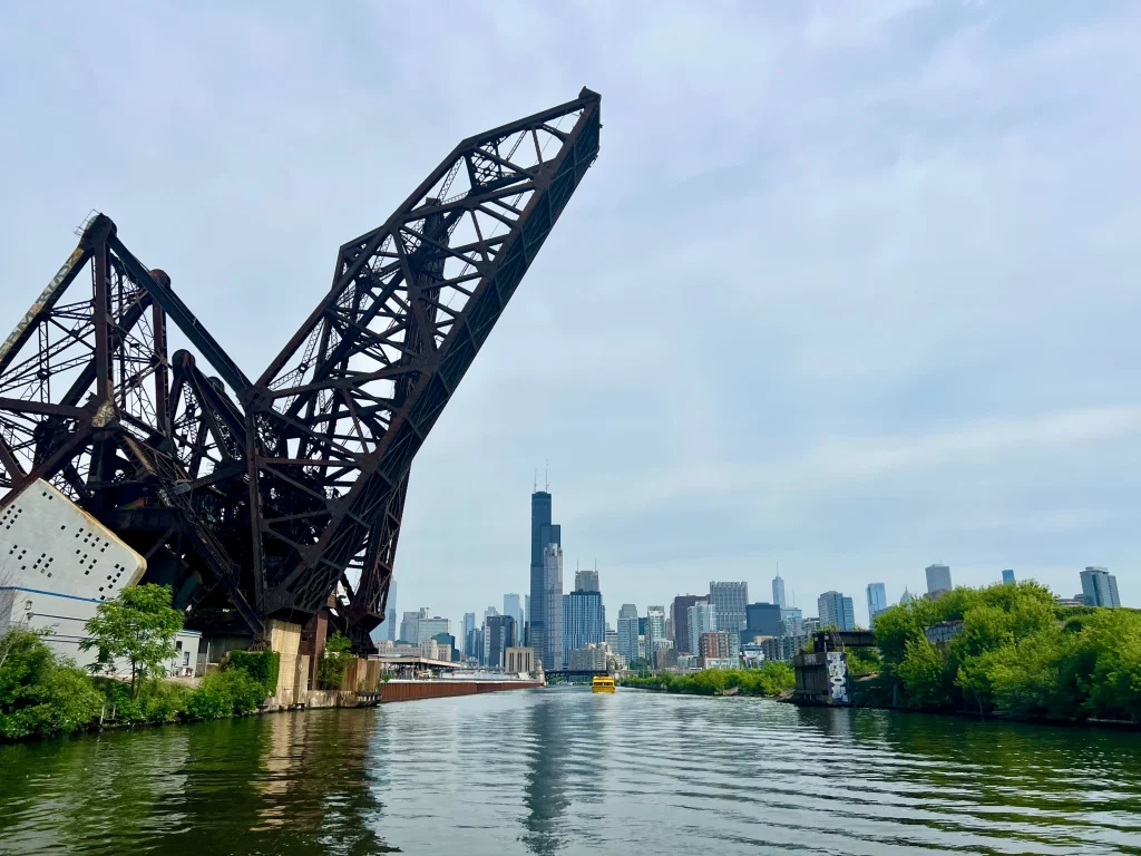 unique tours in Chicago for first-time visitors Architectural River Cruise with the Chicago Skyline in the distance.