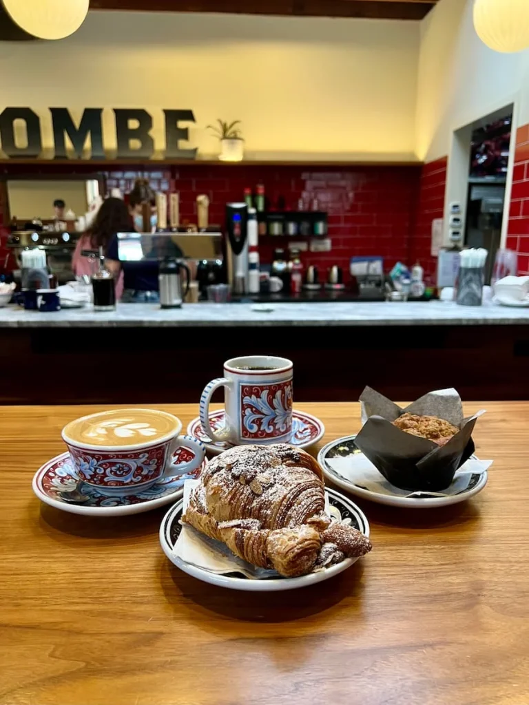 Coffees and breakfast cakes with the La Colombe Coffee Roasters, with the counter in the background. One of the coffee shops in Chicago for vegetarians