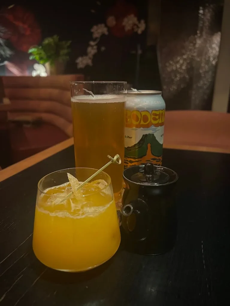 A Bodem beer and can with the Mez-Cal Maybe cocktail at PLANTA Queen, Chicago, vegetarian friendly food in Chicago