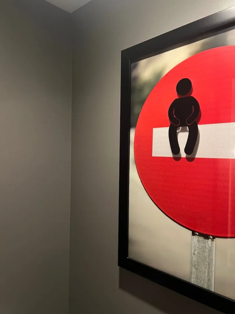 No entry toilet sign at Moxy, Chicago, framed at located in the toilet cubicle of rooms