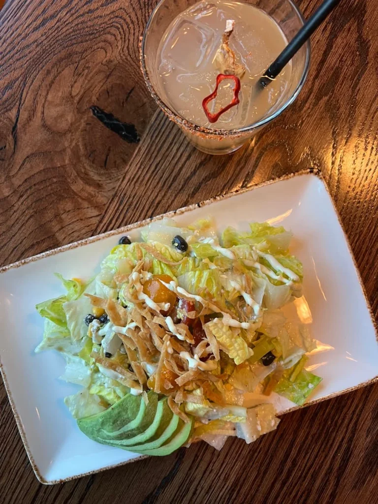 Top lay of the Lirica vegetarian salad with the spicy pineapple Fresno cocktail, Chicago