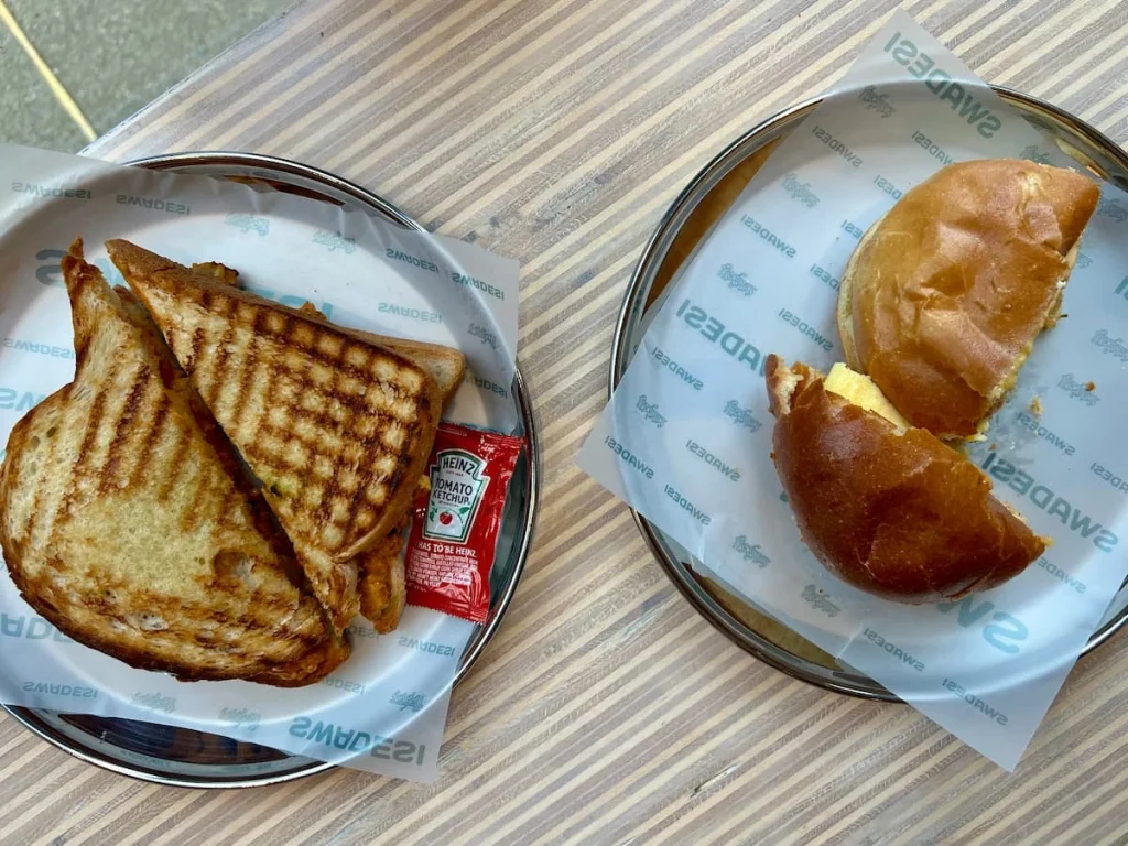 Top lay of vegetarian breakfast sandwich and paneer tikka sandwich at Swadesi in Chicago
