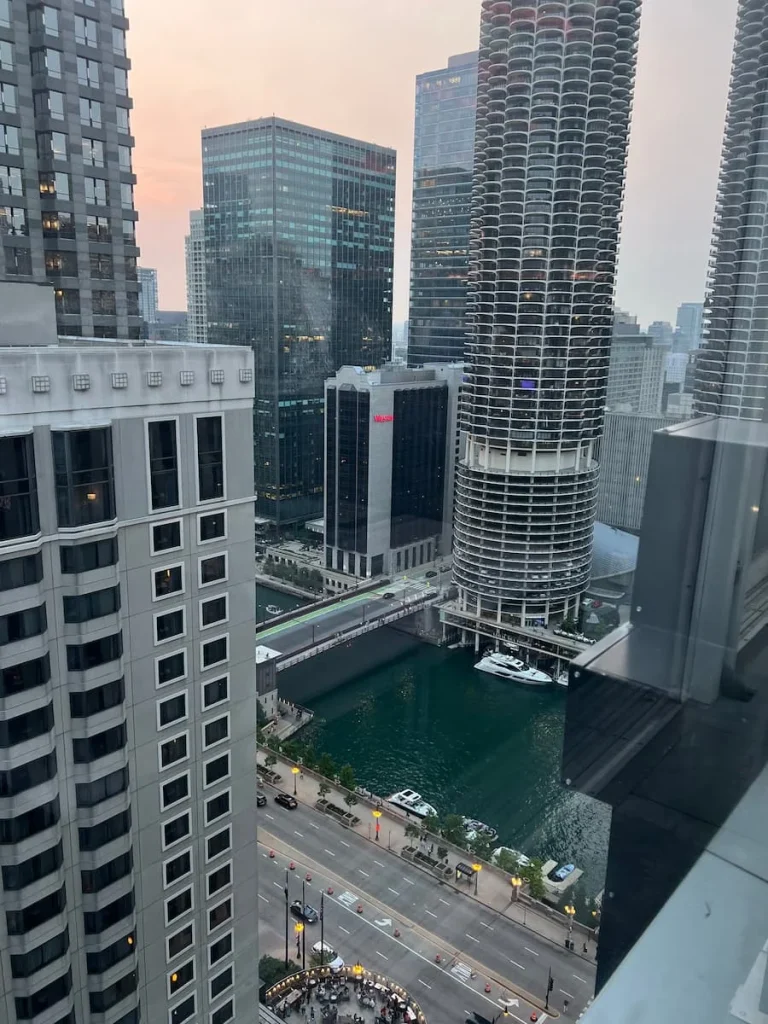 Skyscraper and Chigcao River side view from the floor to ceiling windows at Roof on thewit in Chicago