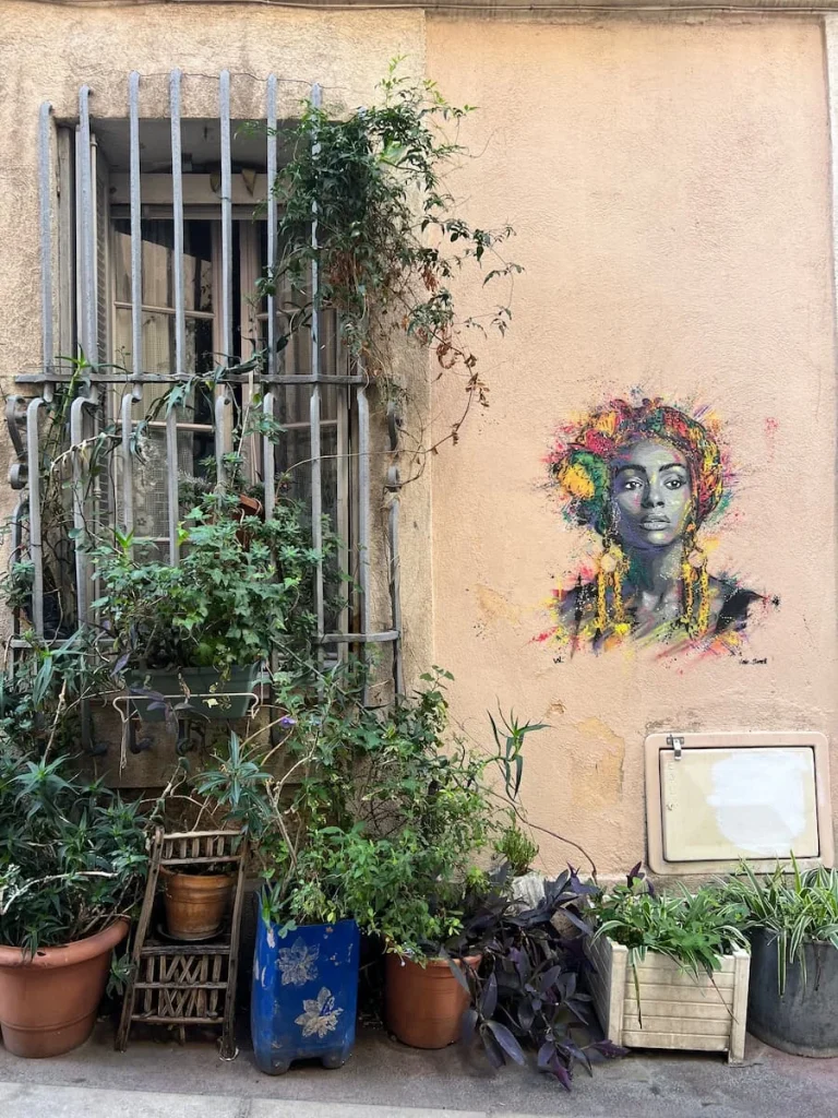 Mural of a lady on wall in Le Panier, Marseille
