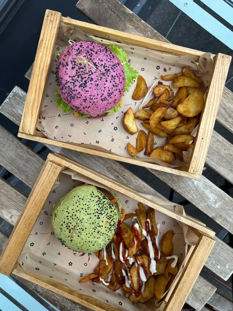 Flatlay of green adn purple burger at Flower Burger, Marseille