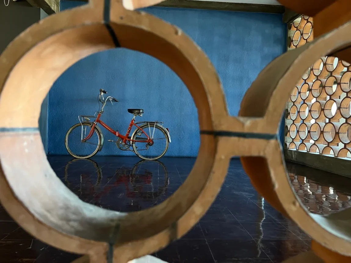 A bicycle view through a circular grid at Cité Radieuse Le Corbusier, Marseille