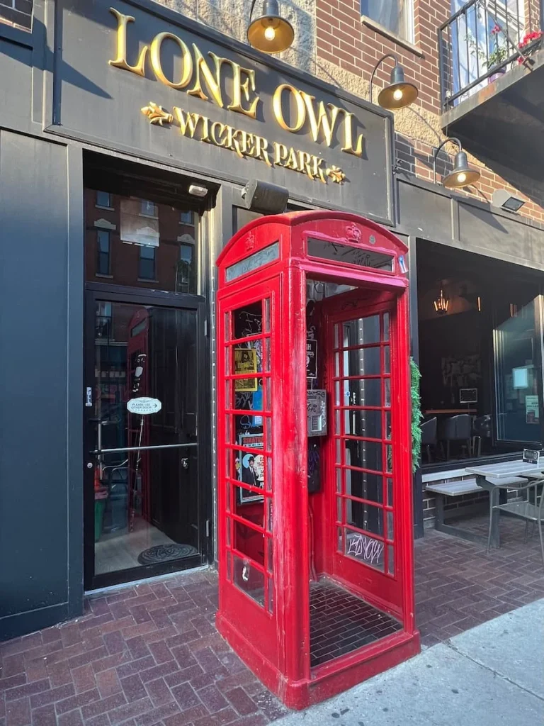 Red Phone box outside The Owl bar in Wicker Park, Chicago