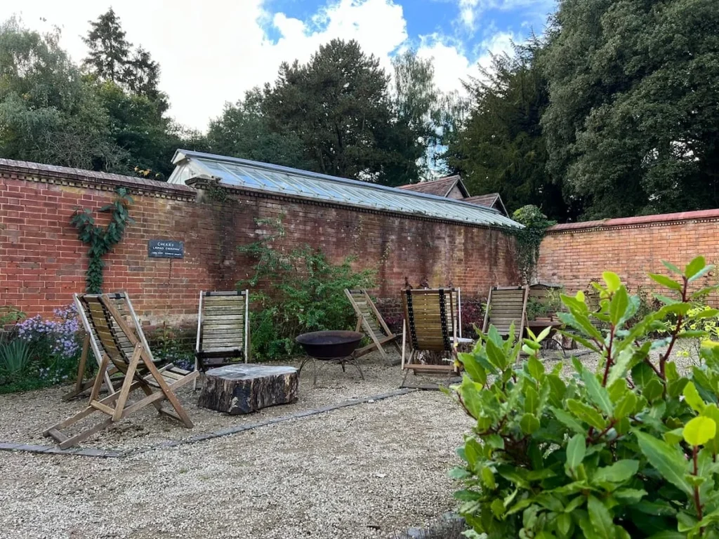 The Walled Garden at Hampton Manor with wooden slated chairs