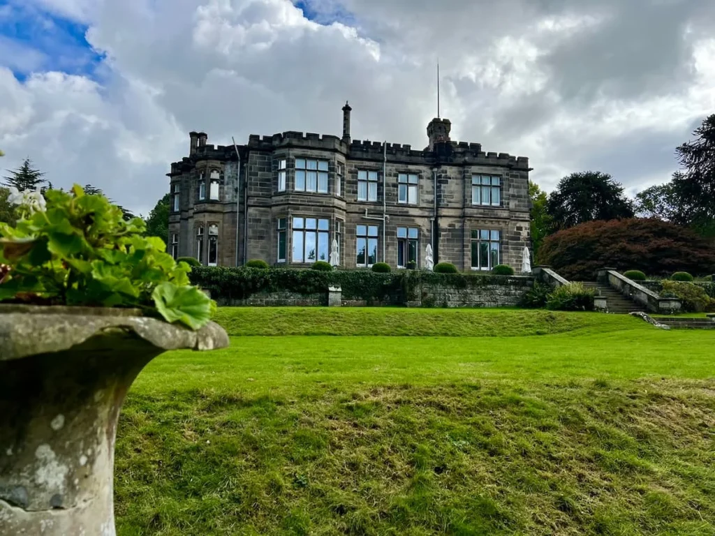 Sustainable Foodie staycation at Hampton Manor. Hampton Manor house and clock tower from the lawned gardens
