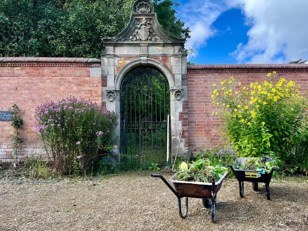 The walled garden with wheel barrows