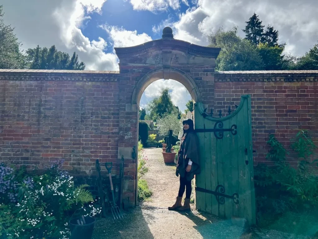 The Walled Garden at Hampton Manor with Bejal standing in gateway