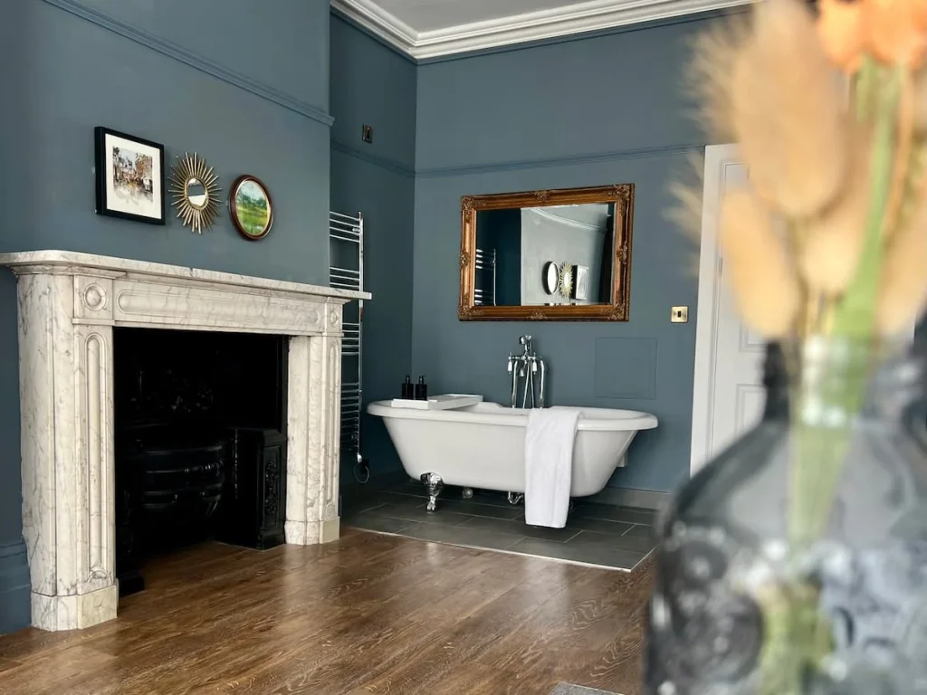 White freestanding roll top bath in superior room at St. Martins Lodge, Leicester