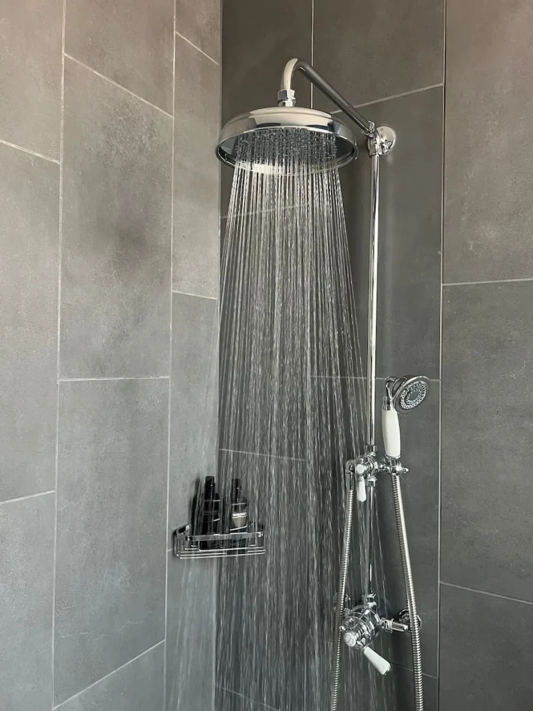 Rain shower on in the bathroom at St Martins Lodge, Leicester