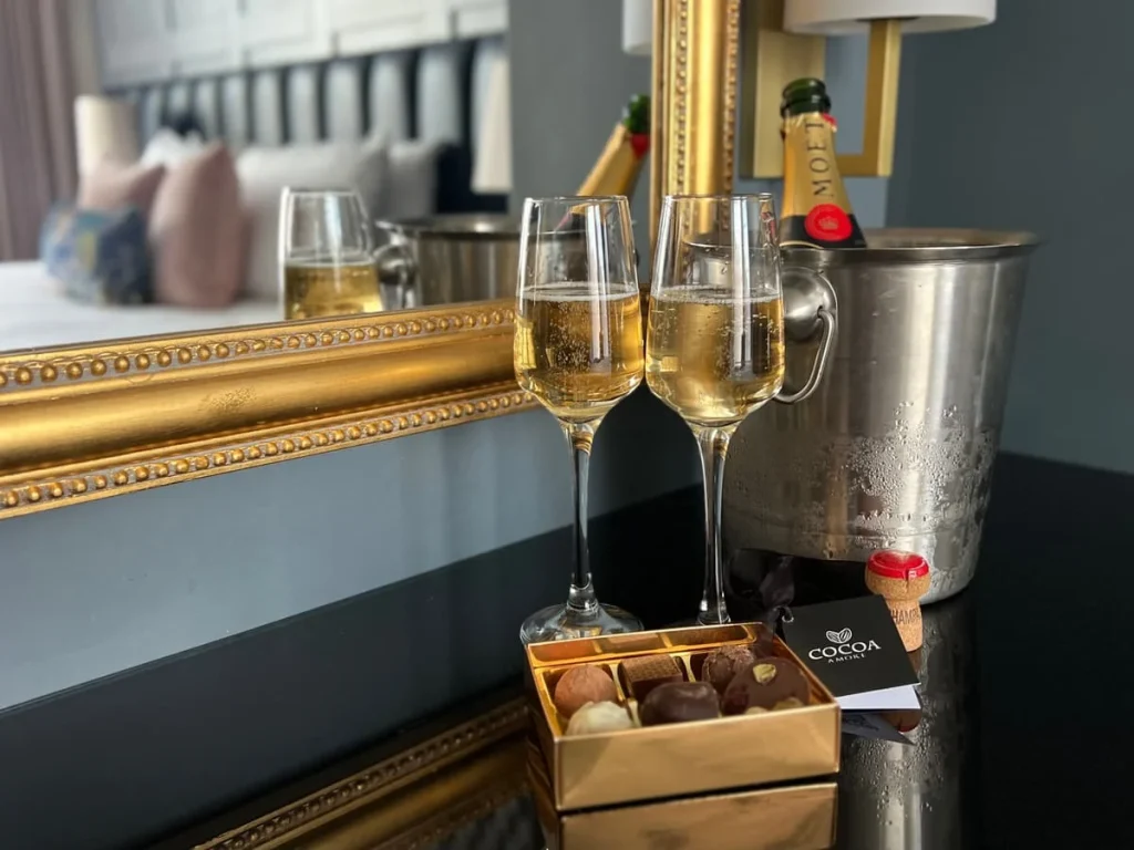 Moet & Chandon Champagne with cocoa Amore chocolates on dressing table at St Martins Lodge, Leicester