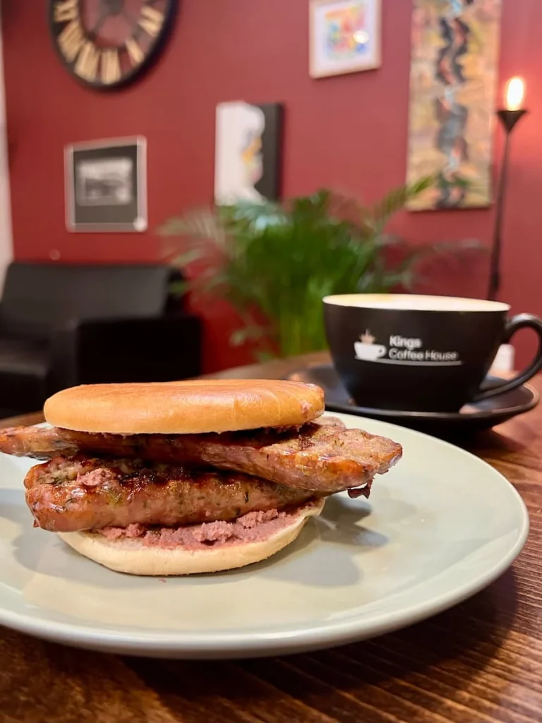 sausage with pate in a bagel at Kings Coffee House, Leicester