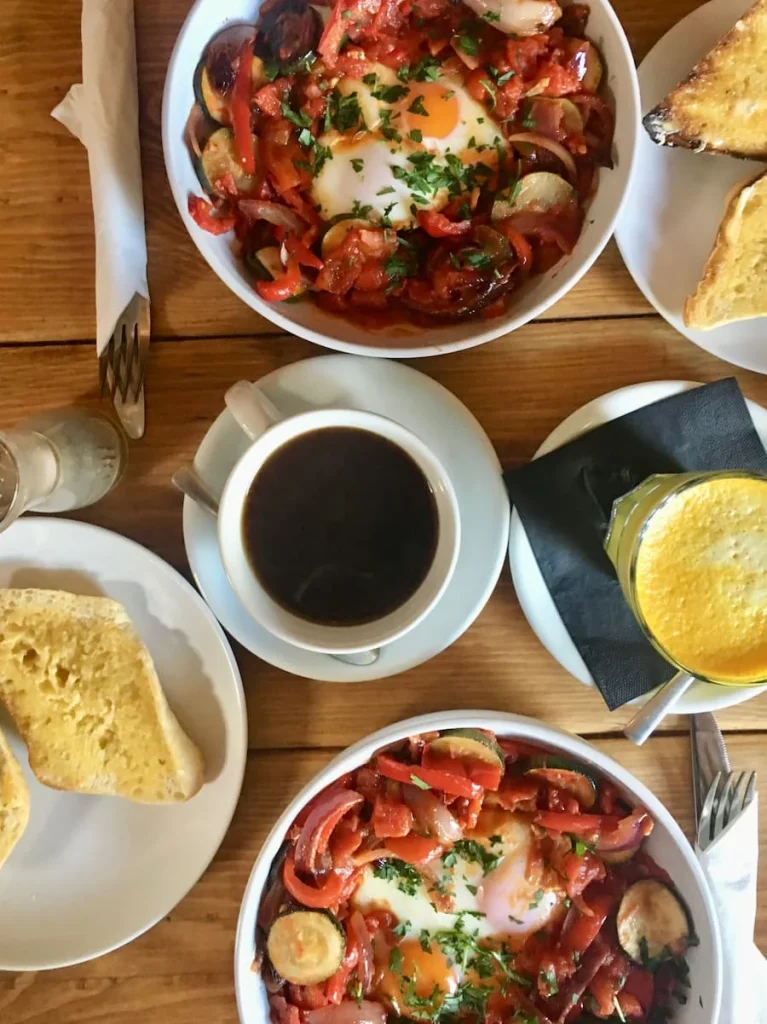 Shakshuka and turmeric lattes top lay at Kai, Leicester