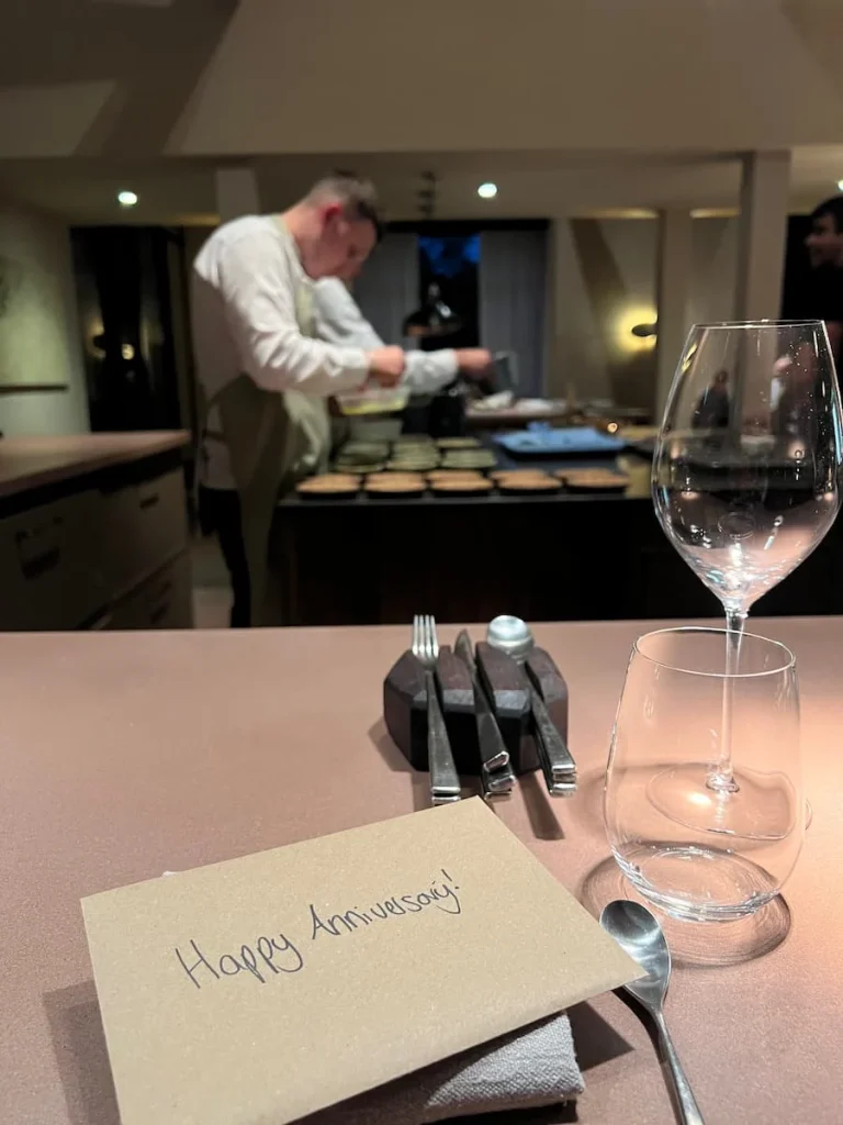 Grace & Savour chefs counter with chefs in the background, Hampton in Arden